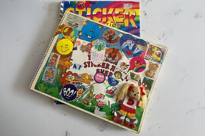 A stack of sticker books with an assortment of animals on the cover