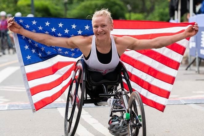 Susannah carrying U.S. flag