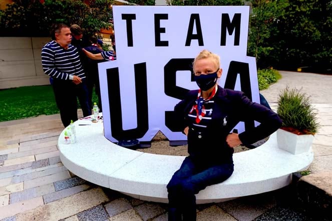 Susannah seated while wearing mask