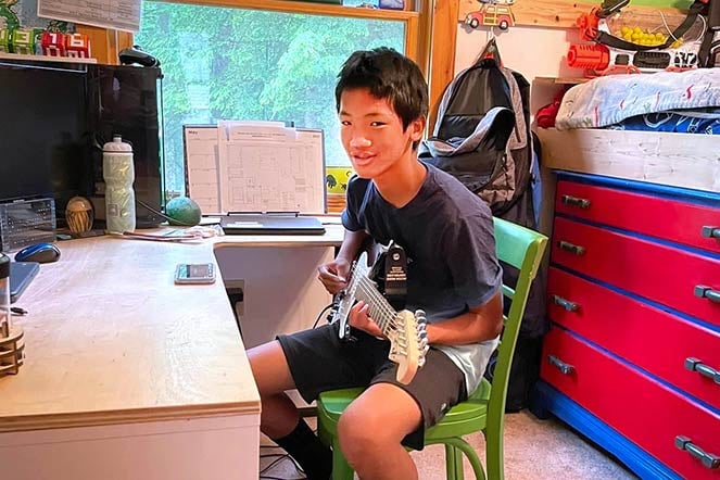 Teddy playing guitar