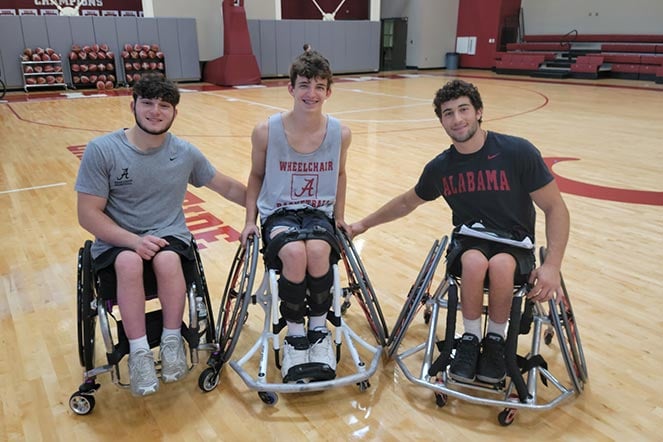 three male wheelchair basketball players