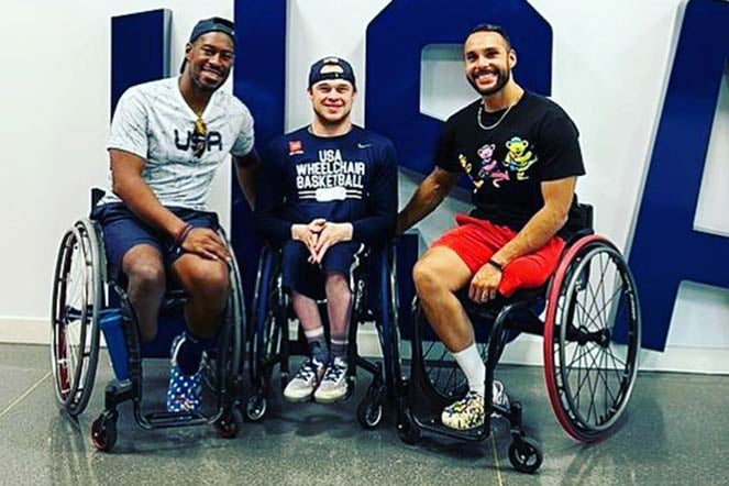 Three male wheelchair para athletes
