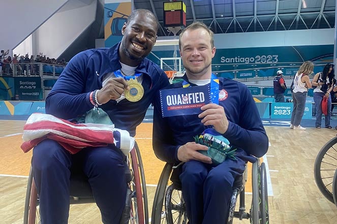 two male wheelchair para athletes on basketball court