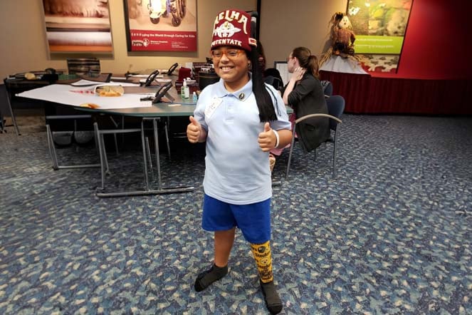 orthopedic patient Carlos wearing fez