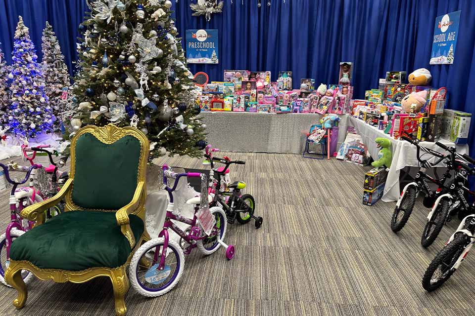 a room filled with toys and a Christmas tree