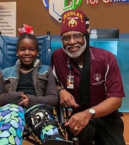 shriner-volunteering-patient-in-wheelchair