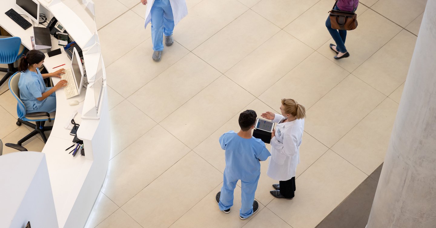 A group of people in blue scrubs.