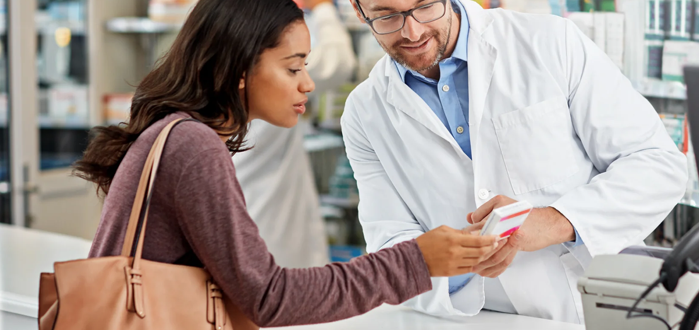 pharmacist explaining medication to customer