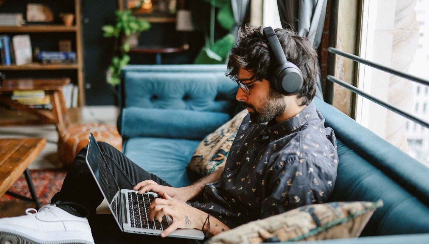 Man working diligently on his laptop
