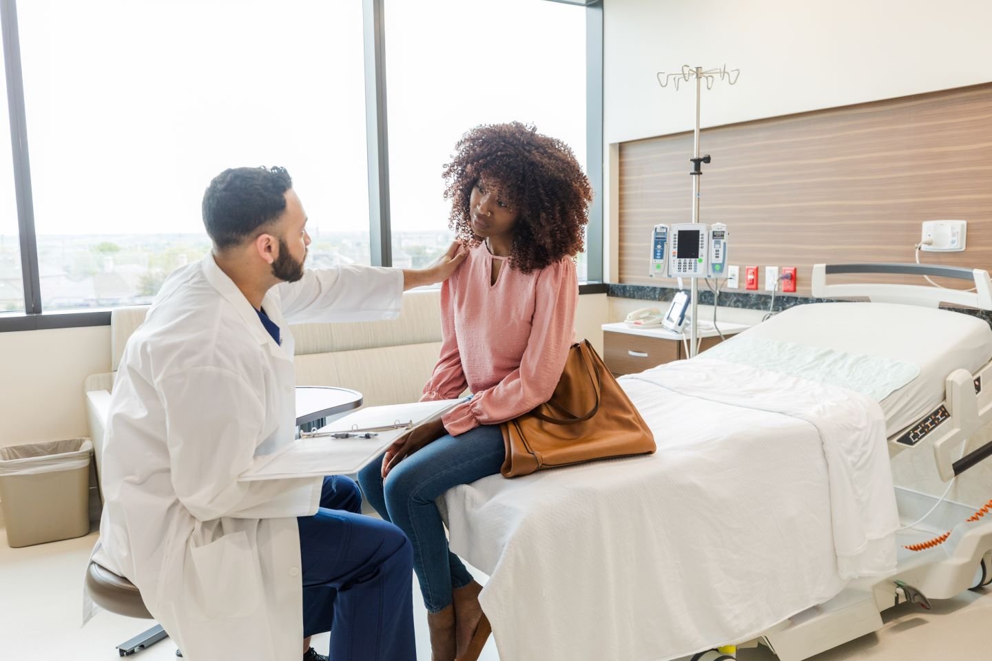 Provider and patient in hospital setting