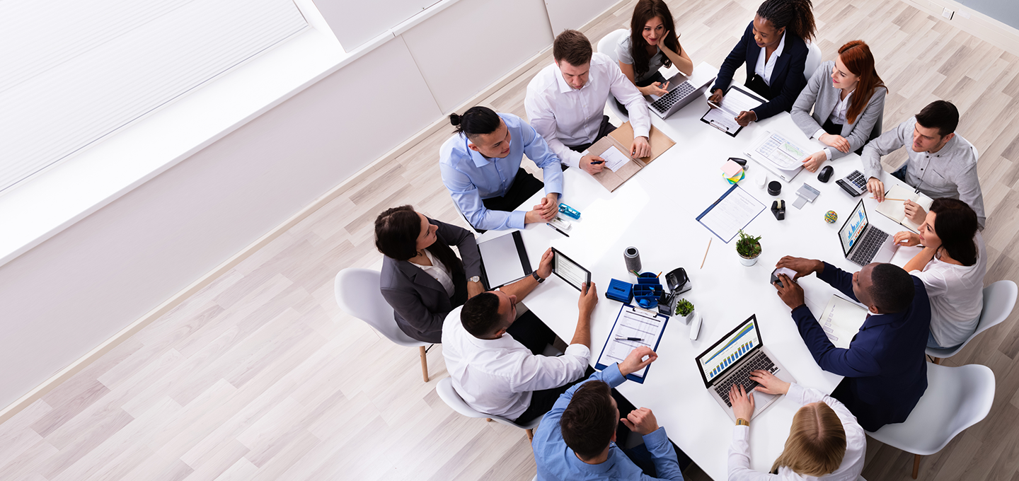 aerial shot of group of people around round table