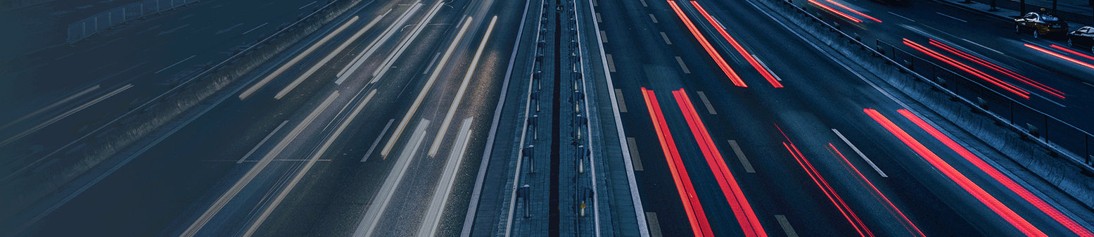 Picture of a busy traffic with red and white lights
