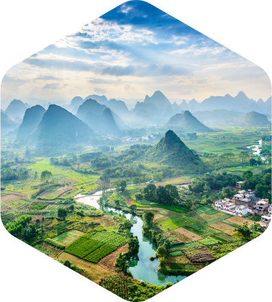Green landscape with the river and hills in the background