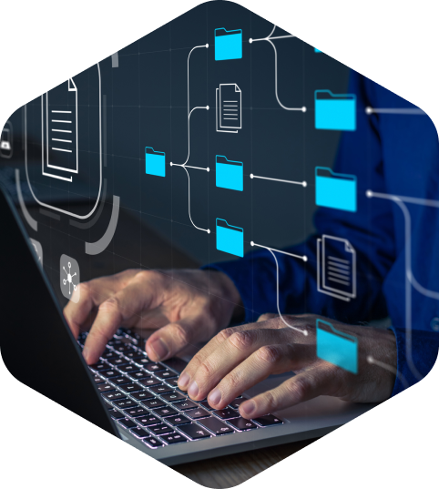 Person typing on a laptop with folder structure