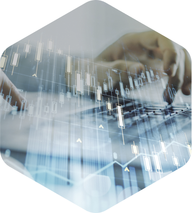 Person typing on a keyboard with financial graphs in foreground
