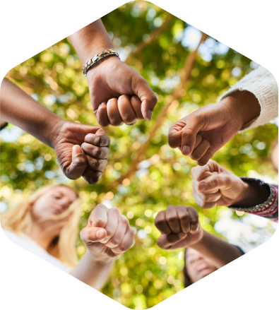 People of different cultures putting their hands together
