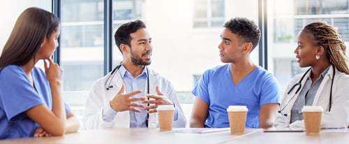 A group of healthcare employees enjoying a cup of coffee.