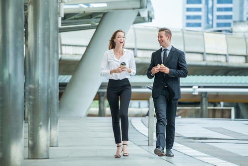 A man and a woman at working talking.