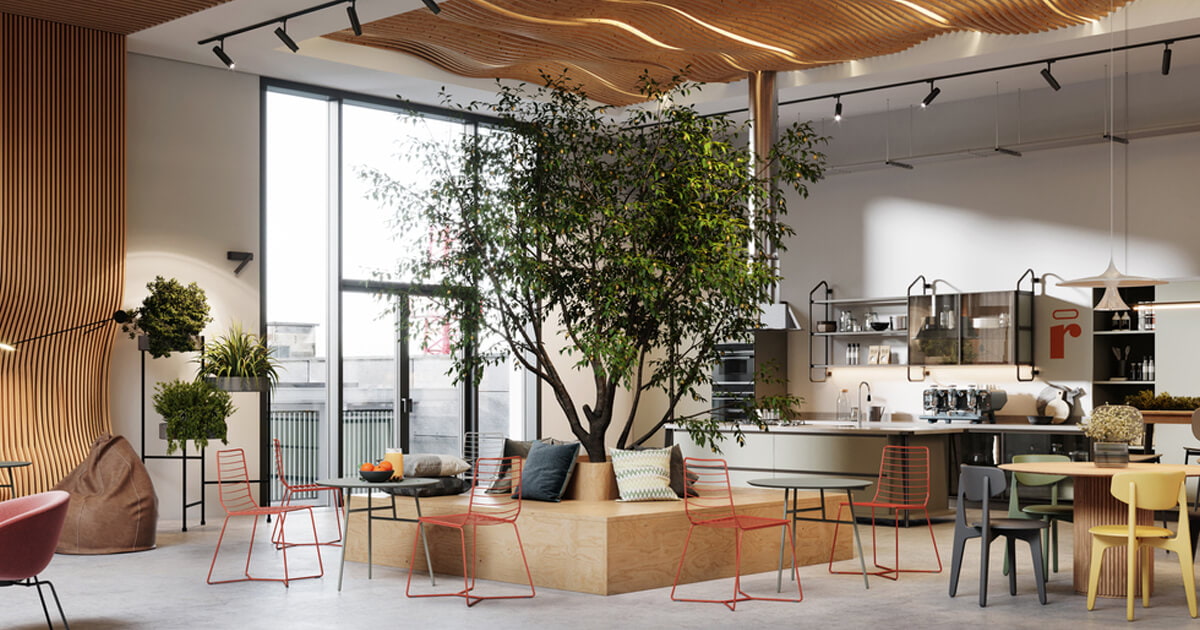 Modern lounge with trees, colorful chairs, large windows, and a kitchen area with coffee machines and shelving.