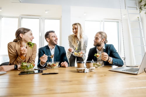 A group of employees eating lunch.