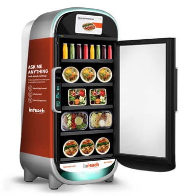 Smart vending machine with an open door displaying assorted fresh meals and bottled drinks inside a sleek, modern design.
