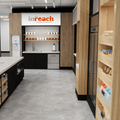 Modern office pantry with a coffee station, shelves stocked with cups and snacks, a water dispenser, and a sleek design featuring wood and black accents.