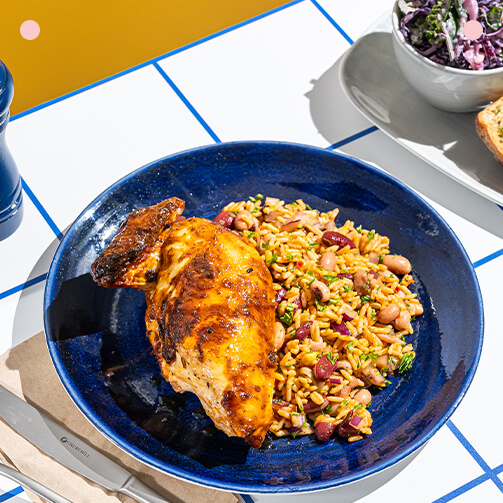 A plate of chicken elegantly arranged on a table