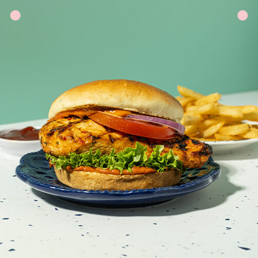 A chicken sandwich accompanied by crispy fries