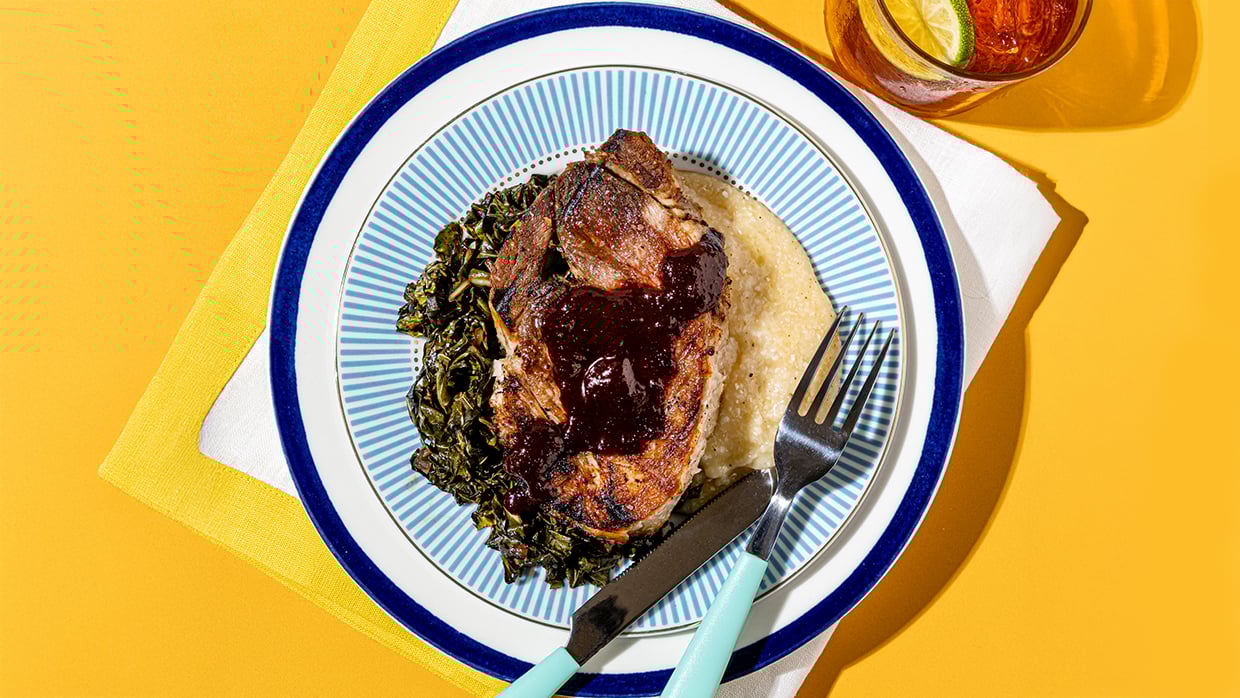 A plate of food sits on a bright yellow table, showcasing a colorful and appetizing meal.