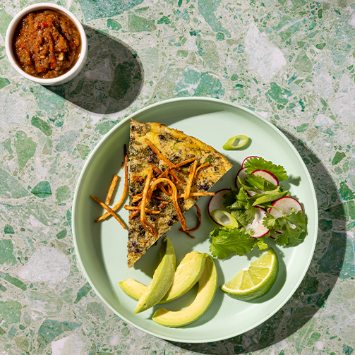 green dish with Black Lentil Frittata Cilantro Salad 