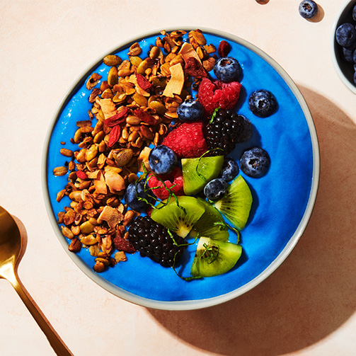 Blended blue spirulina, bananas, mango, and pineapple topped with goji berries and coconut crunch.