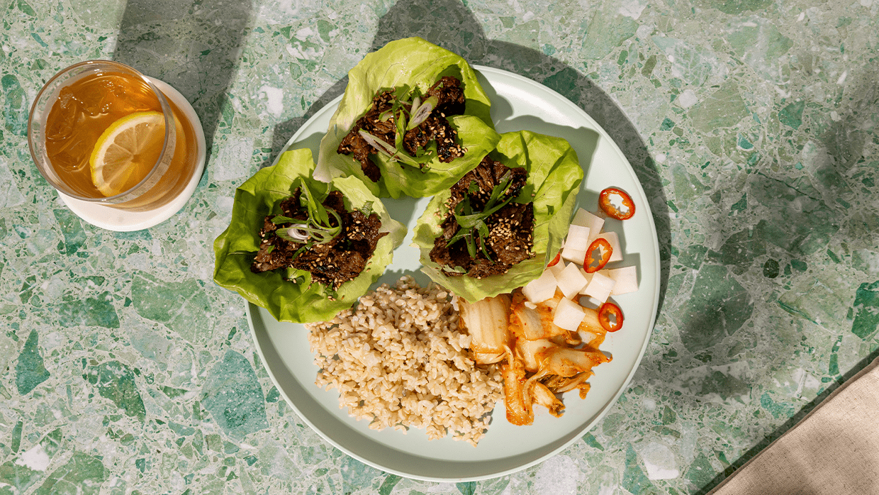Ginger-soy beef with brown rice, kimchi, pickled daikon and lettuce leaves