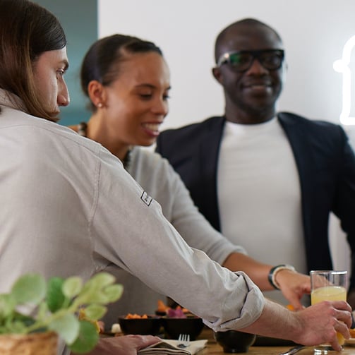 diverse group enjoying food together