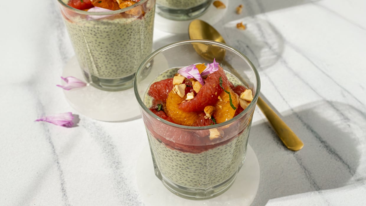 Citrus Chia Parfait layers matcha and coconut chia seed pudding with a vibrant hibiscus citrus salad, ginger candied cashews and fresh mint.