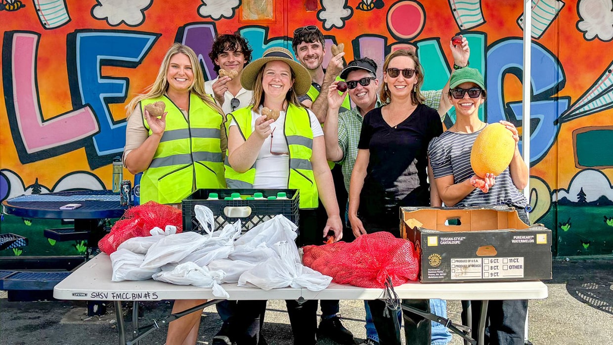 volunteers standing in a group pose 