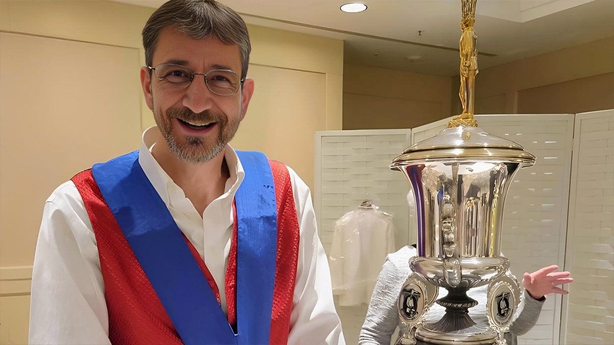 man holding a trophy