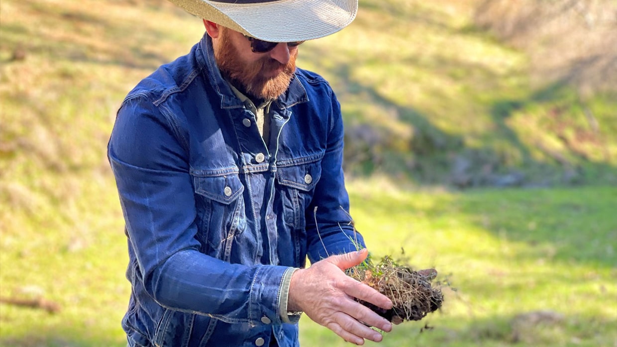 farmer holding soil