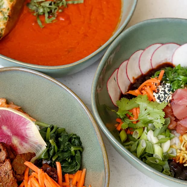 Fresh bowls of soup and salads