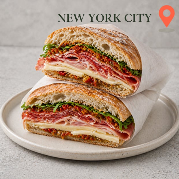 Ham and Swiss sandwich on ciabatta roll with fresh greens