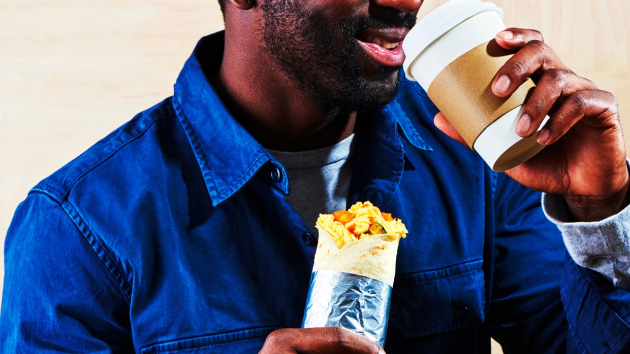 Man eating sandwich wrap