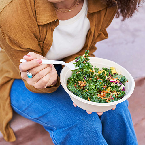 person eating salad