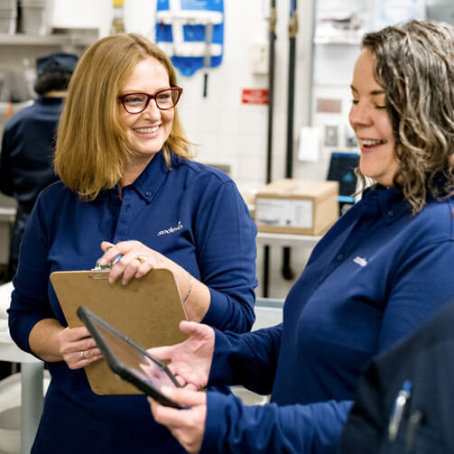 Two women looking some results