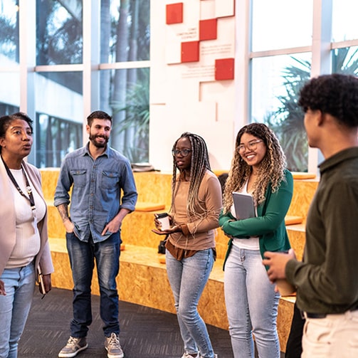 young people smiling in a meeting