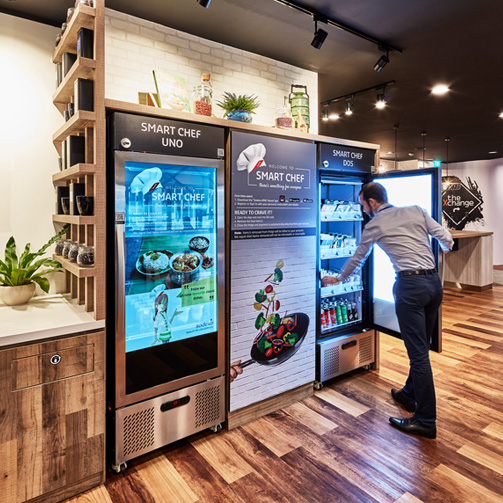 man taking something from a fridge