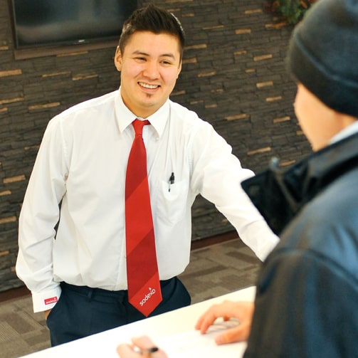 two man talking and smilling