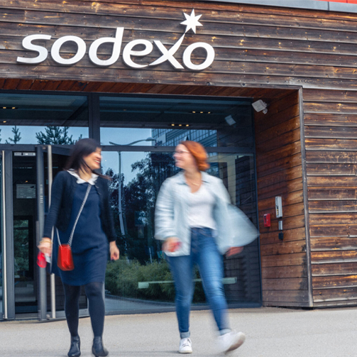 Two women leaving Sodexo building