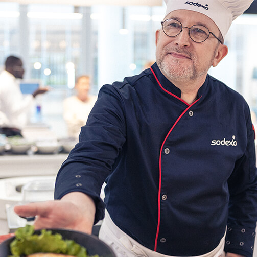 male chef delivering healthy dish