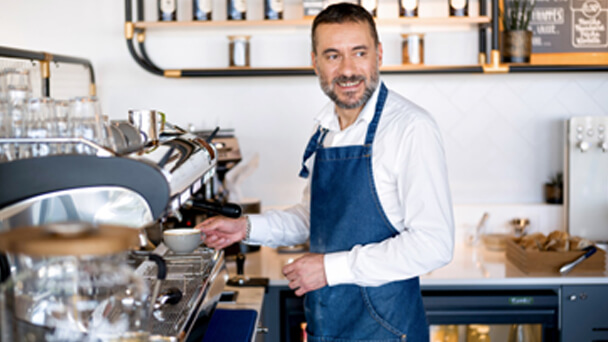 man barista making coffee