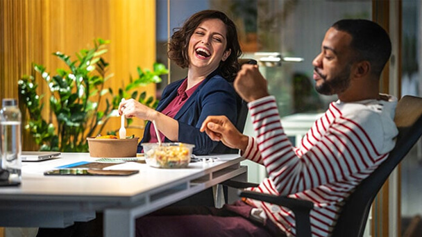 coworkers eating and laughing