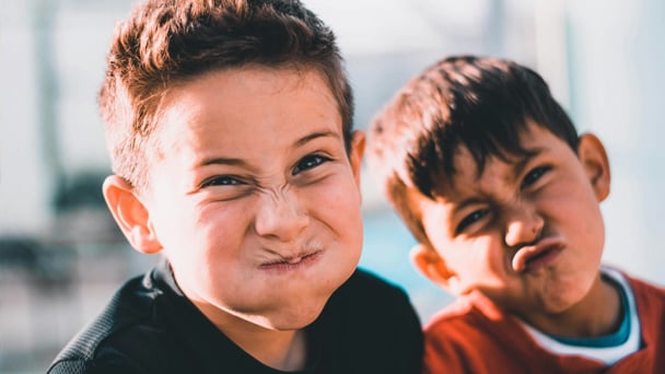 two children making faces